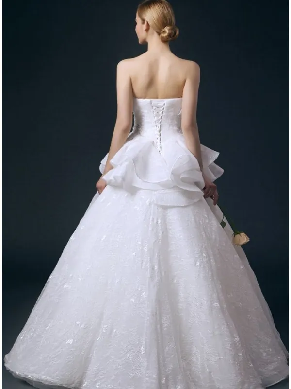 Abito da Sposa online di Pizzo con piccoli volants sulla gonna e decorazione sul corpetto