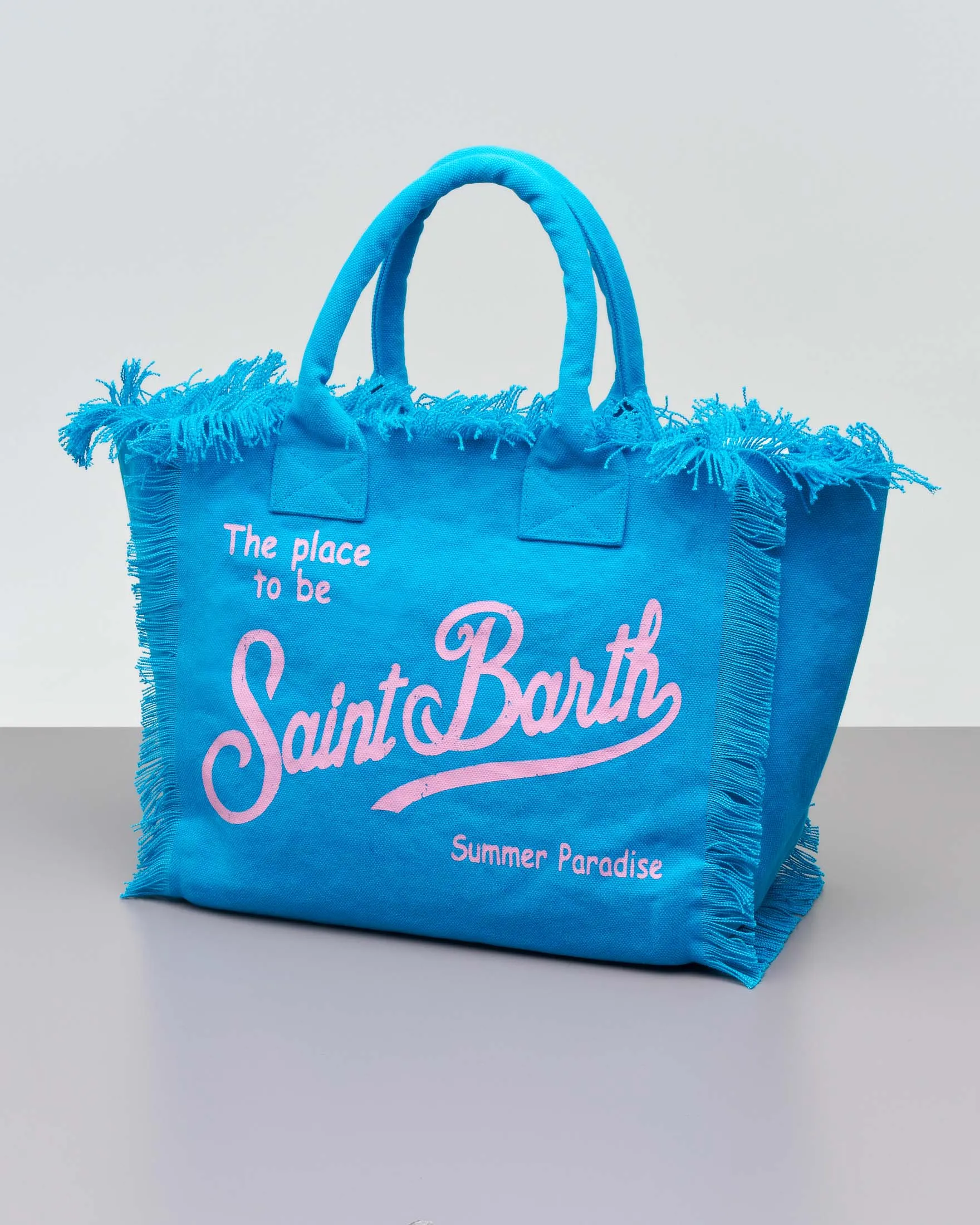 Borsa in canvas di cotone blu China con scritta logo rosa stampata e frange lungo i profili
