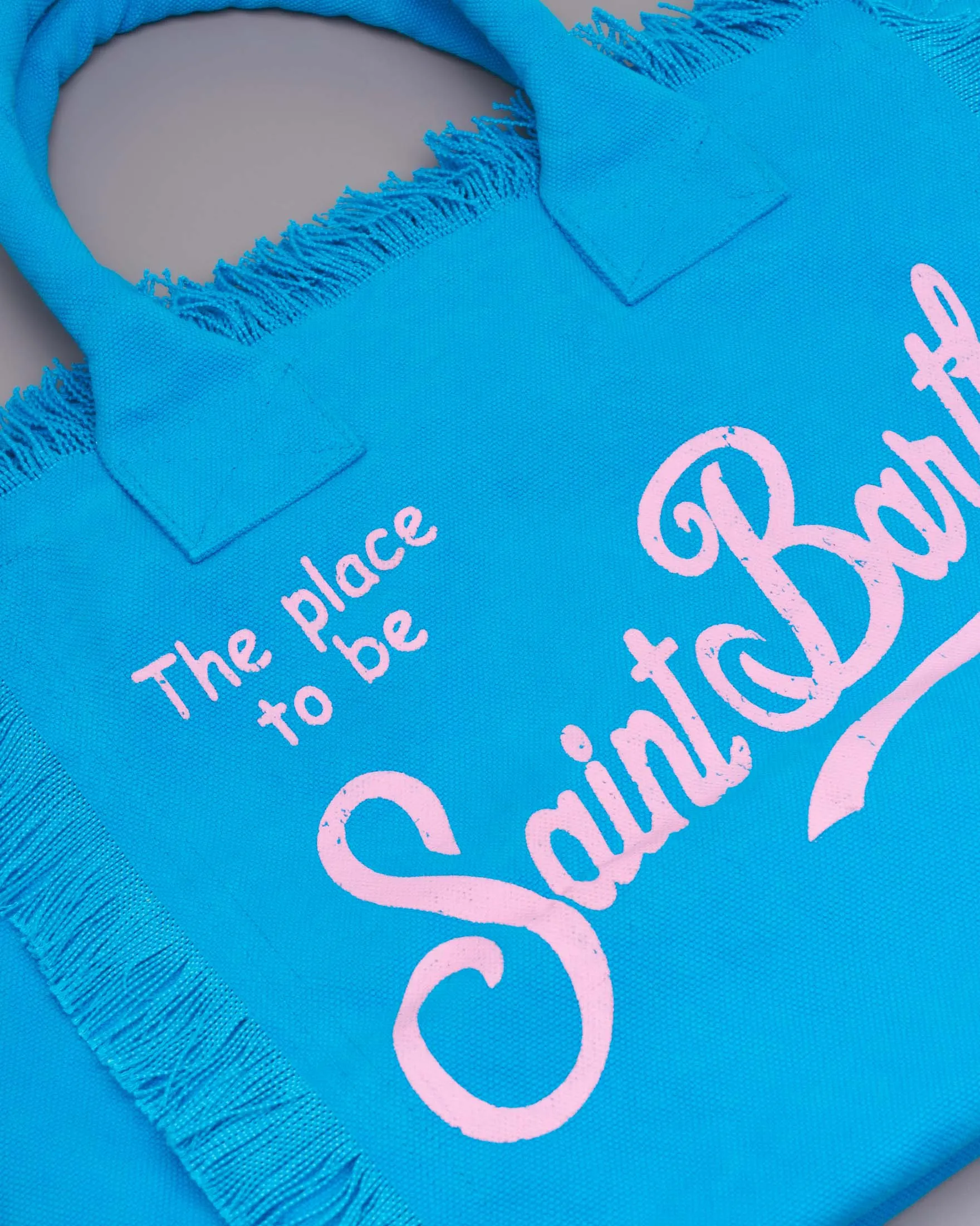 Borsa in canvas di cotone blu China con scritta logo rosa stampata e frange lungo i profili