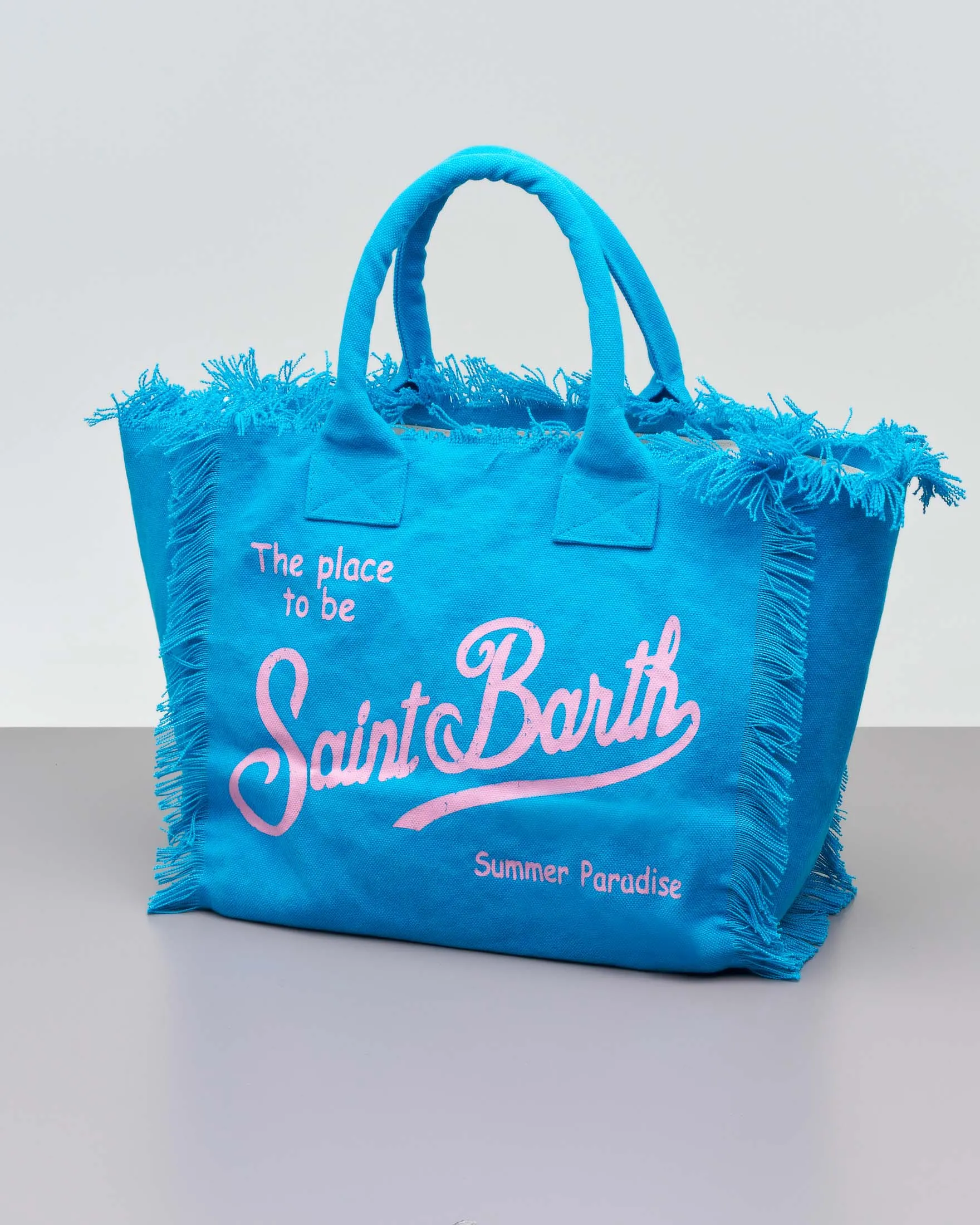 Borsa in canvas di cotone blu China con scritta logo rosa stampata e frange lungo i profili